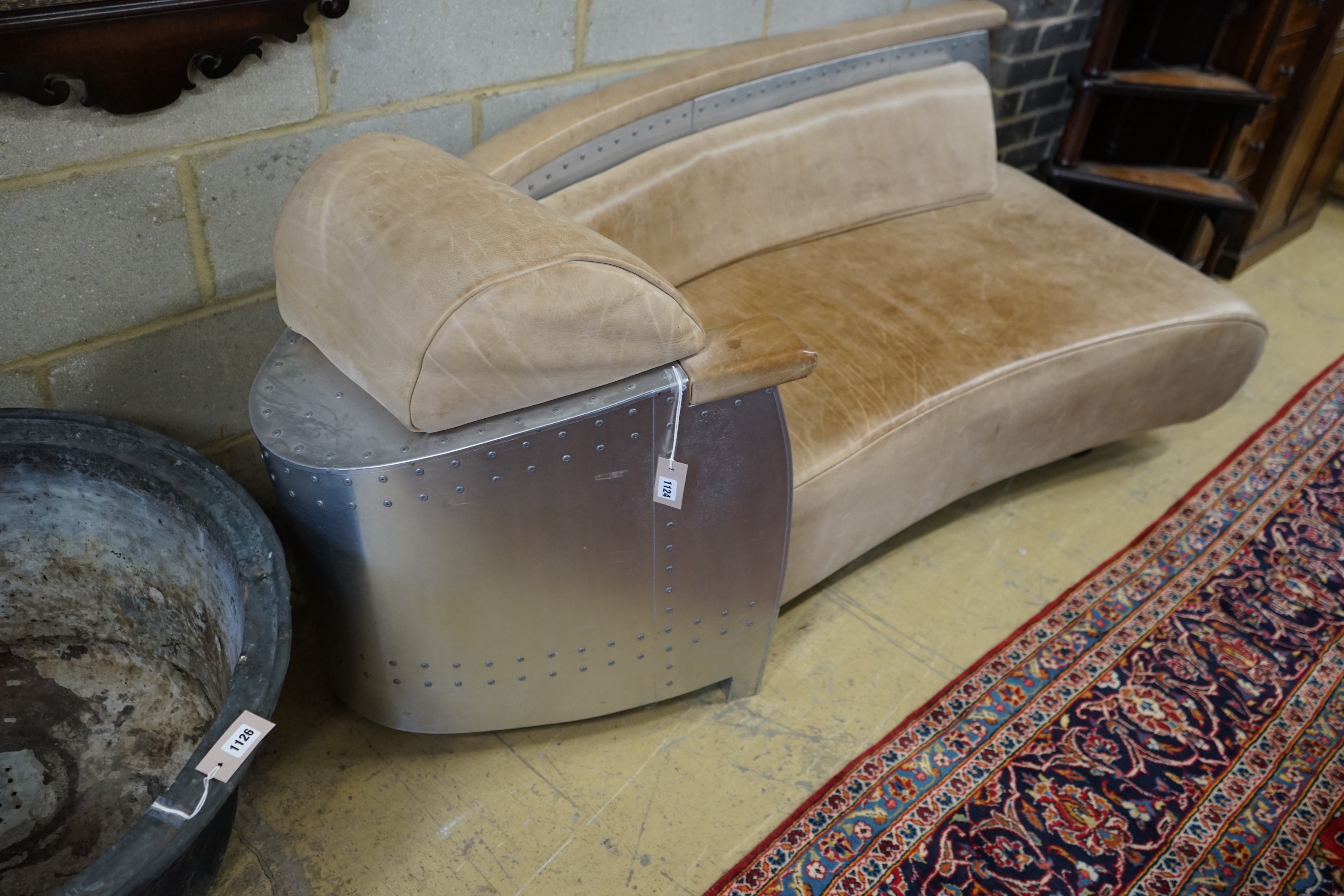 A Timothy Oulton style aluminium and pale brown leather 'Aviator' day bed, length 200cm, width 76cm, height 77cm